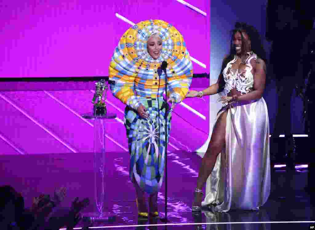 Doja Cat, left, and SZA accept the award for best collaboration for &quot;Kiss Me More&quot; at the MTV Video Music Awards at Barclays Center, Sept. 12, 2021, in New York.