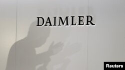 The Daimler logo is seen during a press conference on the second day of the Paris auto show, Oct. 3, 2018.