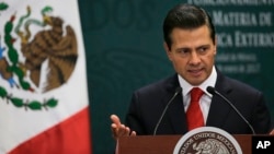 Mexico's President Enrique Pena Nieto speaks during a press conference at Los Pinos presidential residence in Mexico City, Jan. 23, 2017. 