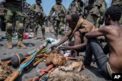 FILE Arrested members of the Wazalendo sect are sat and lined up in Goma, Democratic Republic of the Congo, Aug. 30, 2023. More than 40 people died in clashes in the Congolese city of Goma between protesters from the Wazalendo religious sect and the armed forces.