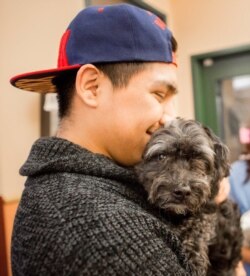 This man is being reunited with his lost dog that was brought to the Dane County Humane Society in Madison, Wisconsin. (Dane County Humane Society)