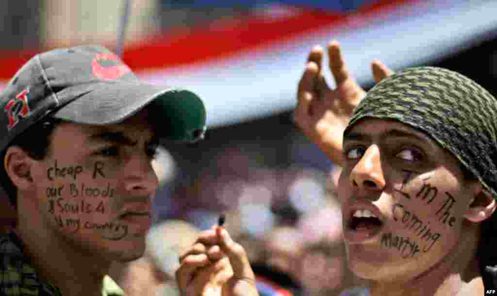 March 24: Anti-government protestors demonstrate for the resignation of Yemeni President Ali Abdullah Saleh, in Sanaa,Yemen. T(AP/Muhammed Muheisen)