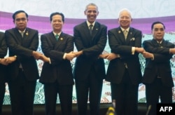 U.S. President Barack Obama, center, participates in the U.S.-ASEAN Summit family photo at the Kuala Lumpur Convention Center, on the sidelines of the Association of Southeast Asian Nations (ASEAN) Summit, Nov. 21, 2015.