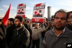 Iranian demonstrators hold anti-Saudi placards in a rally to protest the execution by Saudi Arabia last week of Sheikh Nimr al-Nimr, a prominent opposition Saudi Shiite cleric, in Tehran, Iran, Jan. 4, 2016.