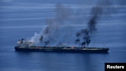 (FILE) Flames and smoke rise from the Greek-flagged oil tanker Sounion, which has been on fire since August 23, on the Red Sea, August 25, 2024.