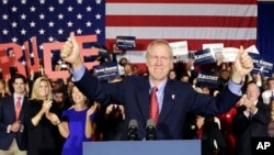 Republican gubernatorial candidate Bruce Rauner of Illinois celebrates his win over Democratic Gov. Pat Quinn, in Chicago, Nov. 4, 2014.