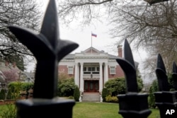 A metal fence surrounds the residence of Russia's consul general Monday, March 26, 2018, in Seattle.