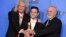 Brian May, left, and Roger Taylor, right, of Queen, and Rami Malek pose with the award for best motion picture, drama for "Bohemian Rhapsody" at the 76th annual Golden Globe Awards on Sunday, Jan. 6, 2019, in Beverly Hills, Calif. 