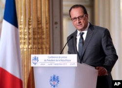 FILE - French President Francois Hollande annoucned his country will send reconnaissance planes over Syria in the fight against the Islamic State group, at the Elysee Palace in Paris, France, Sept. 7, 2015.