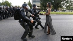 Protestor Ieshia Evans is detained by law enforcement near the headquarters of the Baton Rouge Police Department in Baton Rouge, Louisiana, July 9, 2016. 