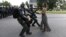 Protestor Ieshia Evans is detained by law enforcement near the headquarters of the Baton Rouge Police Department in Baton Rouge, Louisiana, July 9, 2016. 