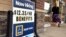 FILE- A "Now Hiring" sign is outside Aldi supermarket in Salem, New Hampshire, July 17, 2018. The Labor Department reports, Oct. 16, 2018, on job openings and labor turnover for August.