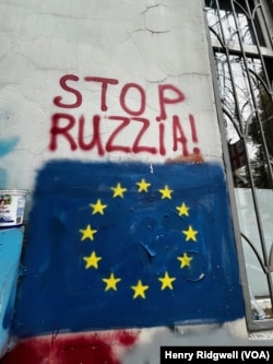 Pro-Western, anti-Russian graffiti can be seen on the streets of Tbilisi, Georgia, on Oct. 11, 2024, in the run-up to elections on Oct. 26.