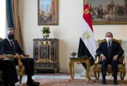 U.S. Secretary of State Antony Blinken, left, meets with Egypt's President Abdel-Fattah el-Sissi at the Heliopolis Presidential Palace on May 26, 2021.