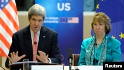 U.S. Secretary of State John Kerry (L) addresses a news conference with European Union foreign policy chief Catherine Ashton in Brussels on April 2, 2014.