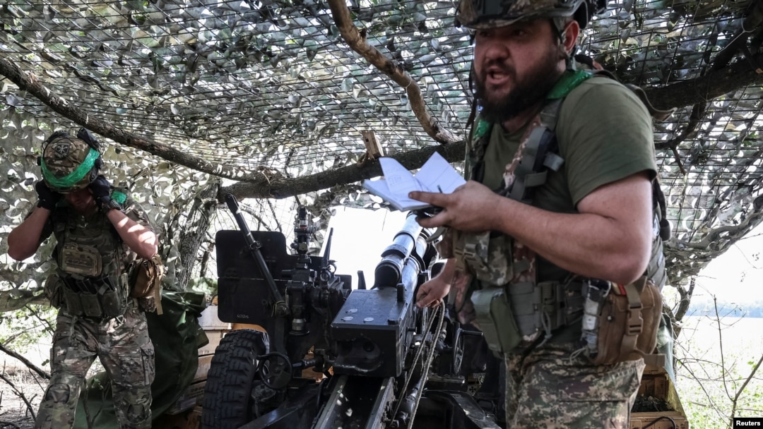 Artillerymen of the National Guard of Ukraine fire a M101A1 howitzer towards Russian troops at a front line near Pokrovsk, Donetsk region, Ukraine, Sept. 5, 2024. (Radio Free Europe/Radio Liberty/Serhii Nuzhnenko via Reuters)