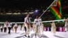 Flag bearers Peter Purcell-Gilpin of Zimbabwe and Donata Katai of Zimbabwe lead their contingent during the athletes' parade at the opening ceremony REUTERS/Kai Pfaffenbach