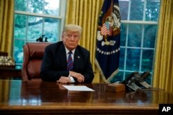 President Donald Trump listens during a phone call with Mexican President Enrique Pena Nieto about a trade agreement between the United States and Mexico, in the Oval Office of the White House, Aug. 27, 2018, in Washington.