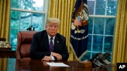 President Donald Trump listens during a phone call with Mexican President Enrique Pena Nieto about a trade agreement between the United States and Mexico, in the Oval Office of the White House, Aug. 27, 2018, in Washington. 