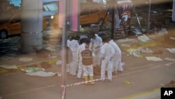 Turkish forensic police officers work at the scene of a blast outside Istanbul's Ataturk airport, June 28, 2016. 