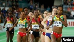 FILE - Genzebe Dibaba of Ethiopia runs on her way to winning the women's 3000 meters final during the IAAF World Indoor Athletics Championships in Portland, Oregon, March 20, 2016. Ethiopia is to begin doping tests on about 200 athletes.