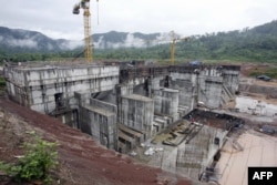 FILE - The regulating dam of the Nam Theun 2 power dam under construction is pictured in this 28 June 2007 photo, in Lao's Nakai plateau.