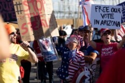 USA, Phoenix, Maricopa, Supporters of U.S. President Donald Trump react to a speaker during a protest