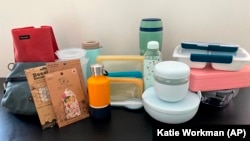 This July 2021 picture shows lunch containers and natural food wraps. There are many more environmentally friendly and practical choices. (Katie Workman via AP)
