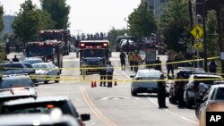 Police and other first responders block East Monroe Ave. in Alexandria, Virginia, June 14, 2017, after a shooting involving House Majority Whip Steve Scalise of Lousiana, at a congressional baseball practice. 