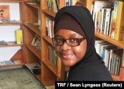 Tchonté Silué, an educational entrepreneur, sits in the library she founded in Abidjan, Ivory Coast, Aug. 12, 2017.