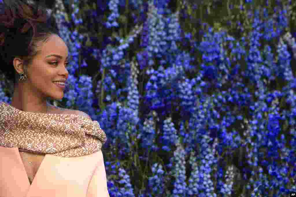 Singer Rihanna smiles as she poses before Christian Dior&#39;s Spring-Summer 2016 ready-to-wear fashion collection, presented during Paris Fashion Week, in Paris, France.