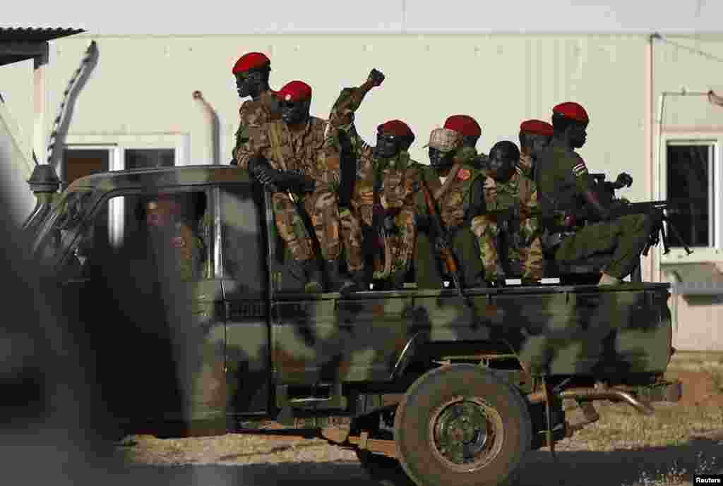 SPLA soldiers sit on a military vehicle in Juba, South Sudan, Dec. 20, 2013.