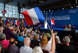 FILE - Supporters attend a rally of Rassemblement National party in Henin-Beaumont, France, May 24, 2019.
