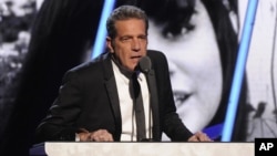 FILE - Glenn Frey of the Eagles speaks at the 2014 Rock and Roll Hall of Fame Induction Ceremony in New York, April, 10, 2014.