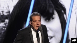 FILE - Glenn Frey speaks at the 2014 Rock and Roll Hall of Fame induction ceremony in New York, April, 10, 2014.