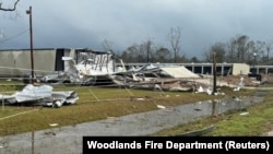 Debris from a structure damaged by the wind lies on the ground in an area affected by the weather, in Montgomery County, Texas, U.S., in this handout photo released Dec. 28, 2024. (Woodlands Fire Department/via Reuters)