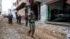 Israeli soldiers operate at the Shajaiya district of Gaza city amid the ongoing conflict between Israel and the Palestinian Islamist group Hamas, in the Gaza Strip