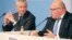 German Economy Minister Peter Altmaier, right, and France's Economy Minister Bruno Le Maire, left, address the media during a joint statement in Berlin, Germany, Feb. 19, 2019. (W. Kumm/dpa via AP) 