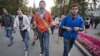 Symbolically-chained Pussy Riot supporters march near the Kremlin Wall, Moscow, Sept. 22, 2012.