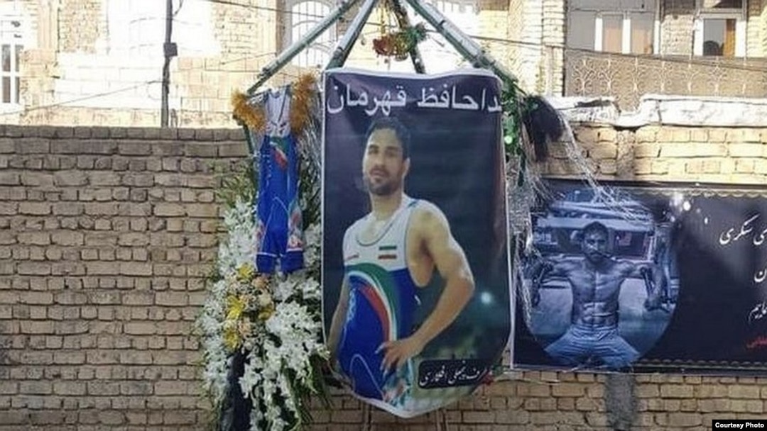 In this image shared widely online, tributes are displayed outside the home of Iranian wrestler Navid Afkari in the city of Shiraz, after Iran executed him on September 12, 2020 for a murder confession that he said was obtained under torture.
