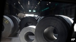 FILE - In this June 28, 2018, file photo, rolls of finished steel are seen at the U.S. Steel Granite City Works facility in Granite City, Ill. 