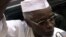 Former Chad President Hissene Habre talks to reporters as he leaves a court in Dakar, Senegal on November 25, 2005.