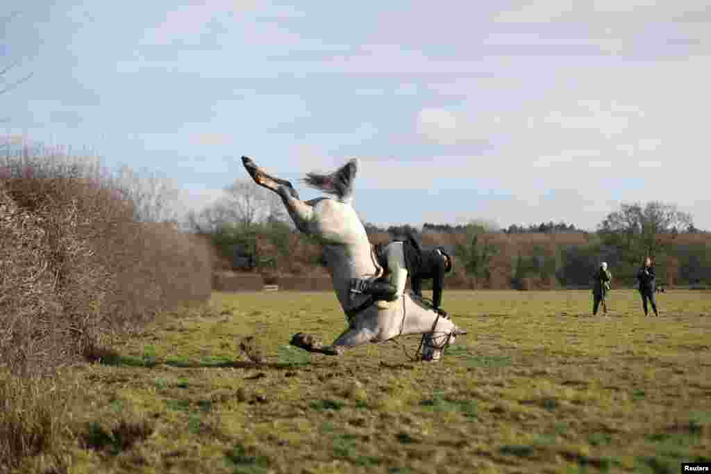 A member of the Old Surrey Burstow and West Kent Hunt crashes as she jumps a fence during the annual Boxing Day hunt in Chiddingstone, Britain.
