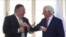 US Secretary of State Mike Pompeo, left, and Polish Foreign Minister Jacek Czaputowicz greet each other with an elbow bump as they meet in Lazienki palace in Warsaw, Poland,