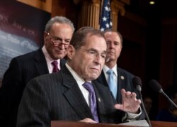 FILE - Rep. Jerrold Nadler, D-N.Y., center, flanked by Senate Minority Leader Chuck Schumer, D-N.Y., left, and Rep. Adam Schiff, D-Calif., speaks on Capitol Hill in Washington, June 14, 2018.