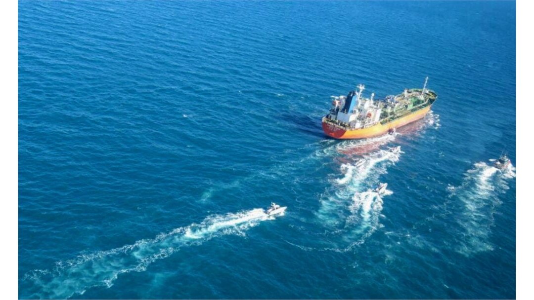 A picture obtained by AFP from the Iranian news agency Tasnim on Jan. 4, 2021, shows the South Korean-flagged tanker being escorted by Iran's Revolutionary Guards navy after being seized in the Gulf.