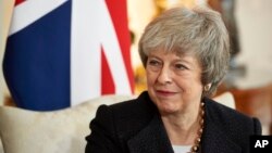 Britain's Prime Minister Theresa May talks with Poland's Prime Minister Mateusz Morawiecki during their bilateral meeting ahead of the UK-Poland Inter-Governmental Consultations, inside 10 Downing Street in London, Dec. 20, 2018. 