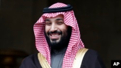FILE- Saudi Crown Prince Mohammed bin Salman visits France, April 9, 2018. The disappearance of Saudi journalist Jamal Khashoggi, Oct. 2, 2018, in Turkey, peels away a carefully cultivated reformist veneer promoted about the Saudi Crown Prince, instead exposing its autocratic tendencies.