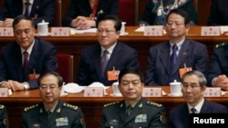 FILE - Chinese Defense Minister Chang Wanquan, front row, center, attends sixth plenary meeting of the National People's Congress at the Great Hall of the People in Beijing, March 16, 2013.