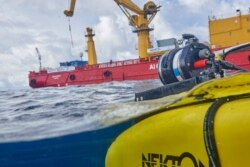 The manned submersible emerges from the water after a dive off the coast of the island of St. Joseph in the Seychelles, Monday April 8, 2019. For more than a month researchers from Nekton, a British-led scientific research group.